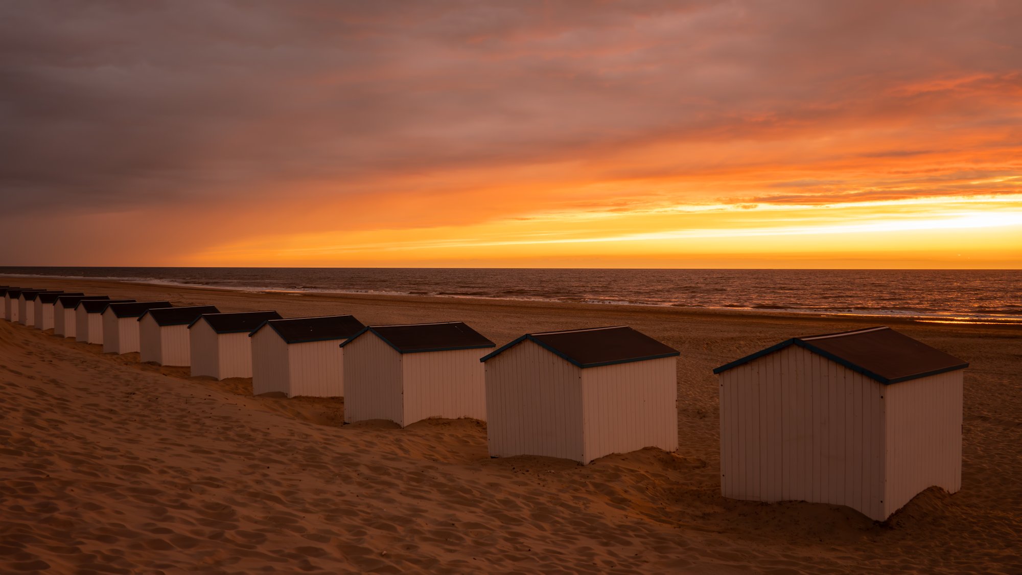 strandhuisjes Texel zonsondergang zee strand